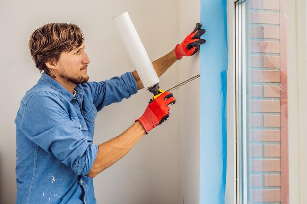 man blue shirt does window installation 247622 16519.jpg