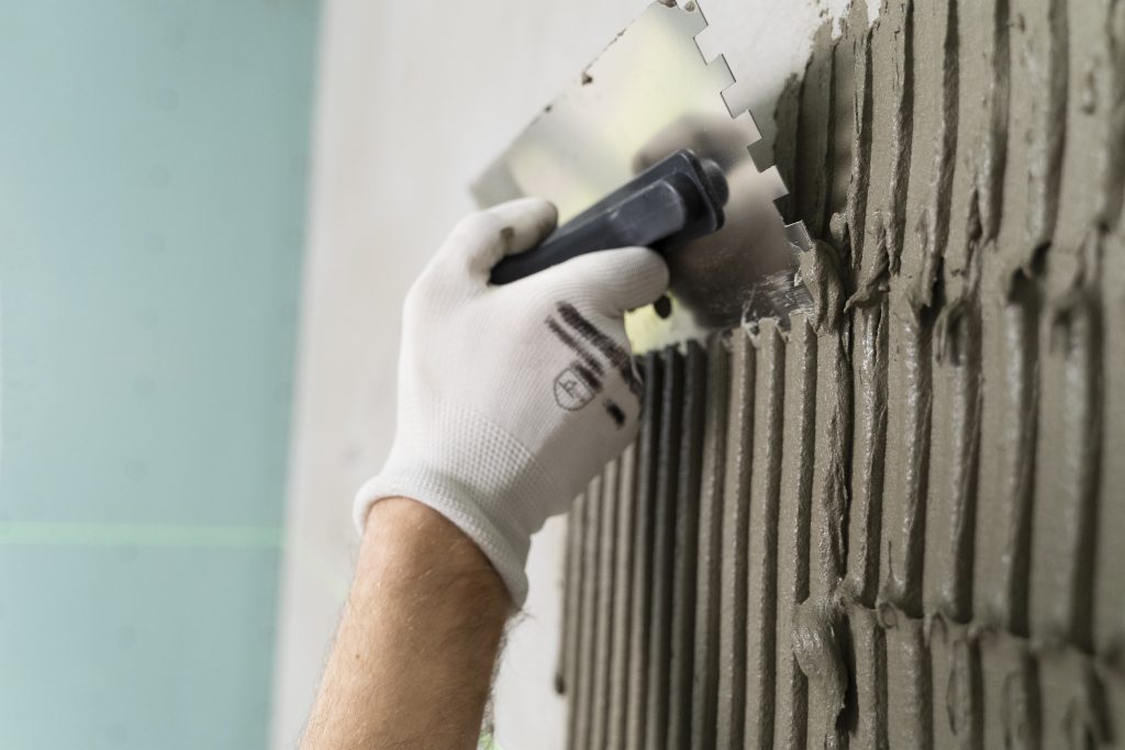 tiler working renovation apartment