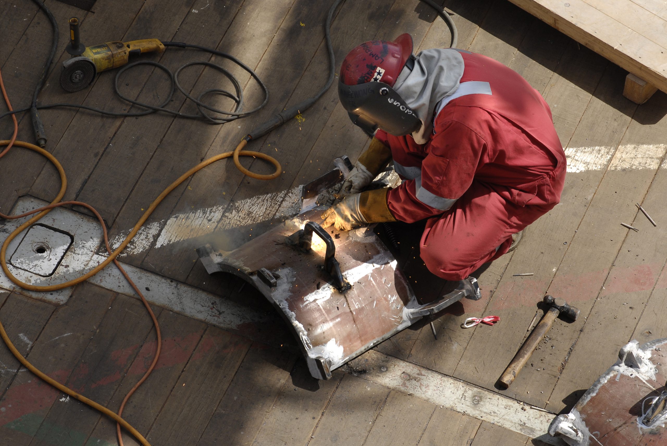 worker working suit fixing metal rack