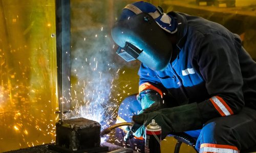 male working with a welding torch